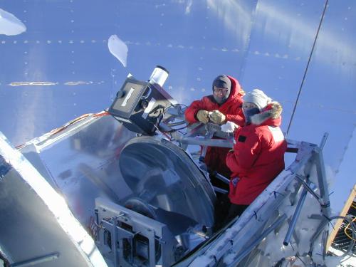 Graduate students Megan Krejny and Hua-bai Li 
working 
at South Pole